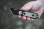 TOPS ALRT XL-03 compact fixed blade knife featuring a black utility blade with a durable angular tip and black canvas micarta handles.