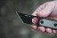 TOPS ALRT XL-03 compact fixed blade knife featuring a black utility blade with a durable angular tip and black canvas micarta handles.