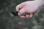 TOPS ALRT XL-03 compact fixed blade knife featuring a black utility blade with a durable angular tip and black canvas micarta handles.