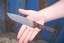 Viking Tactics Norseman knife with tan and green Micarta handle featuring blood red liners and Tungsten Cerakote blade.